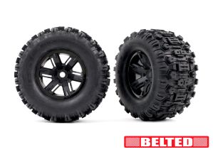 TRA7871 Tires & wheels, assembled, glued (X-Maxx® black wheels, Sledgehammer® belted tires, dual profile (4.3" outer, 5.7" inner), foam inserts) (left & right)