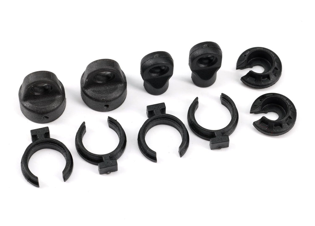 TRA9762A Shock cap (2)/ spring perch (2)/ rod end (2)/ spring preload spacer (4)