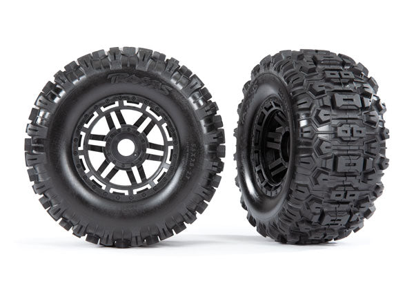 TRA8973 Tires & wheels, assembled, glued (black wheels, dual profile (2.8' outer, 3.6' inner), Sledgehammer  tires, foam inserts) (2) (17mm splined) (TSM rated)