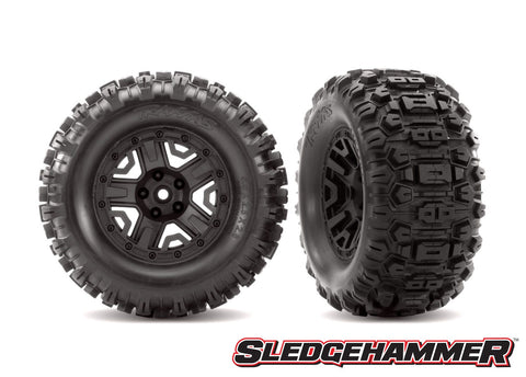 TRA6792 Tires & wheels, assembled, glued (black 2.8' wheels, Sledgehammer  tires, foam inserts) (2) (TSM rated) SledgeHammer